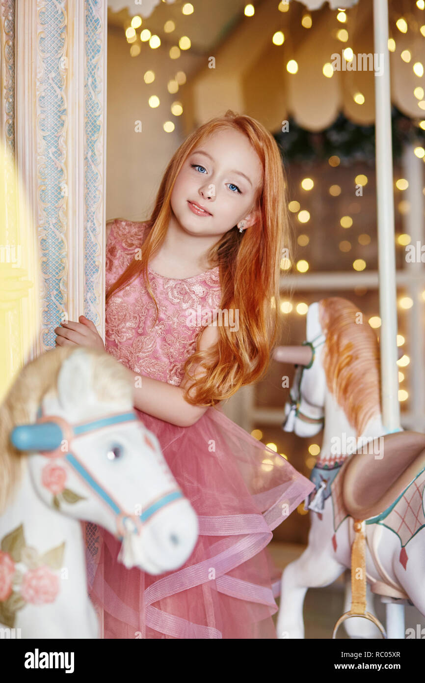 Beautiful Red Haired Girl With Long Hair And Blue Eyes Rides A