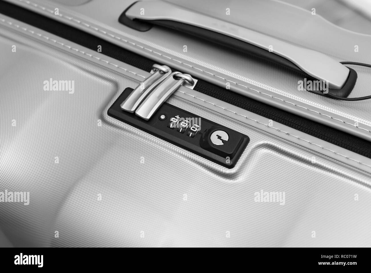 Closeup detail of a suitcase briefcase with focus on combination lock