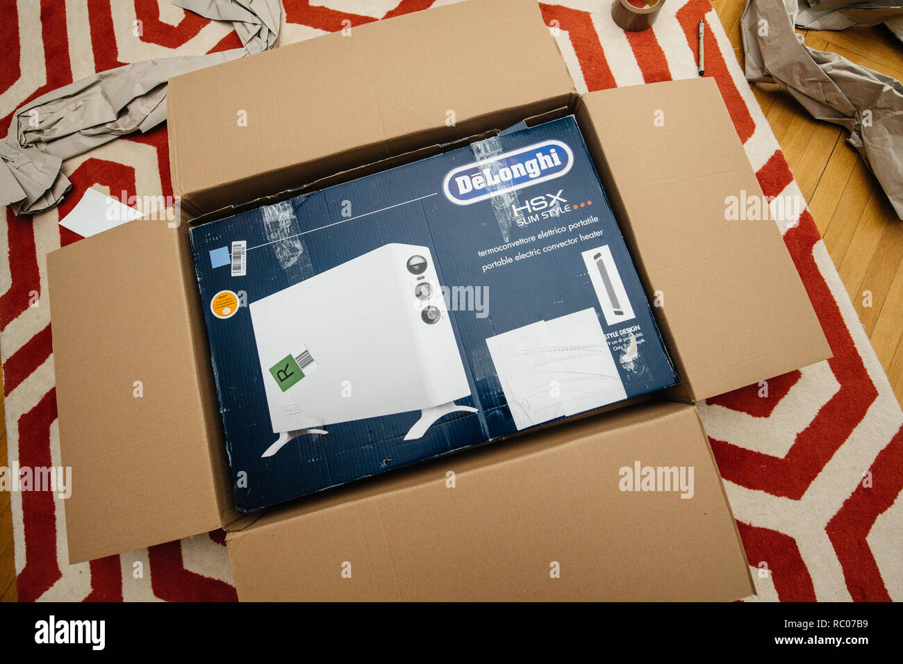 PARIS, FRANCE - FEB 7, 2018: Unboxing large cardboard box containing  italian DeLonghi air convection heater bought from Amazon Warehouse Deals  Stock Photo - Alamy