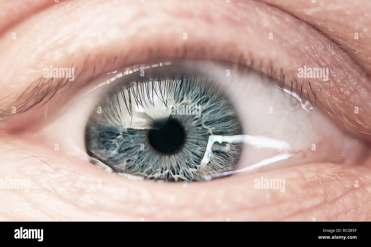 Close up of a man's light blue colored eye Stock Photo