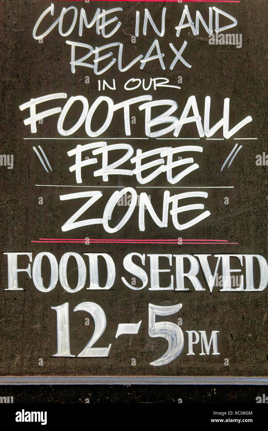 Pub Sign on a wall in Canterbury, England, advertising a football free zone Stock Photo