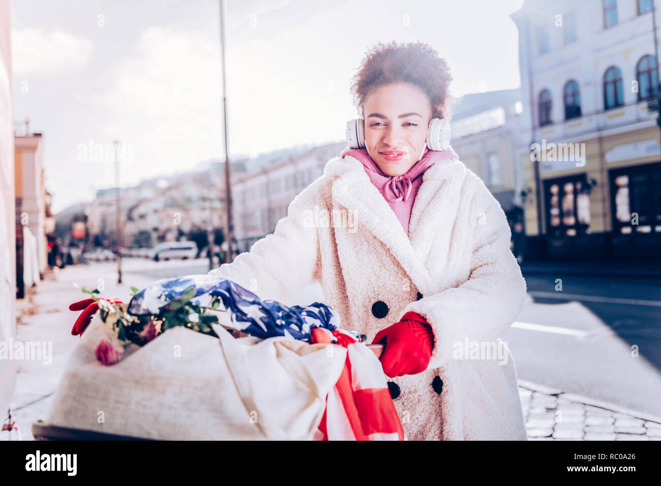 Charming brunette woman looking straight at camera Stock Photo - Alamy