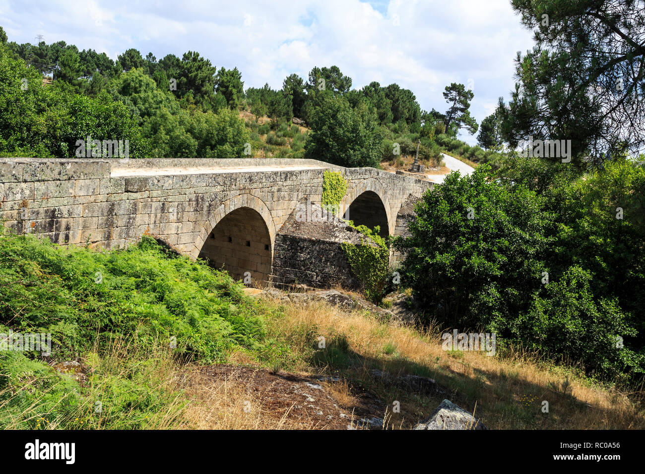 Well preserved bridge of three arches and inverted V board, built in 1652 over the Mondego River on the site of a roman structure, near Celorico da Be Stock Photo