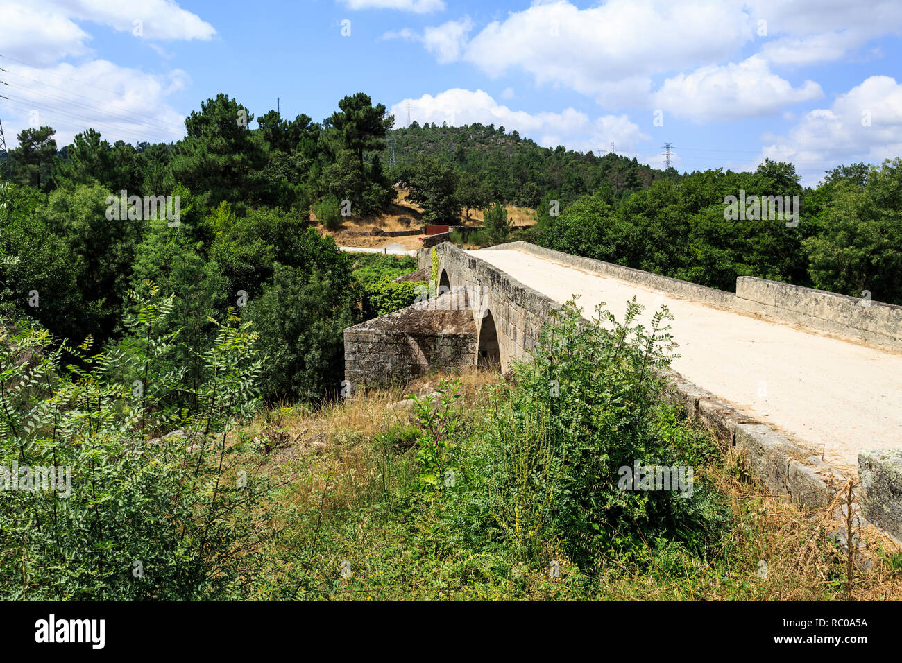 Well preserved bridge of three arches and inverted V board, built in 1652 over the Mondego River on the site of a roman structure, near Celorico da Be Stock Photo