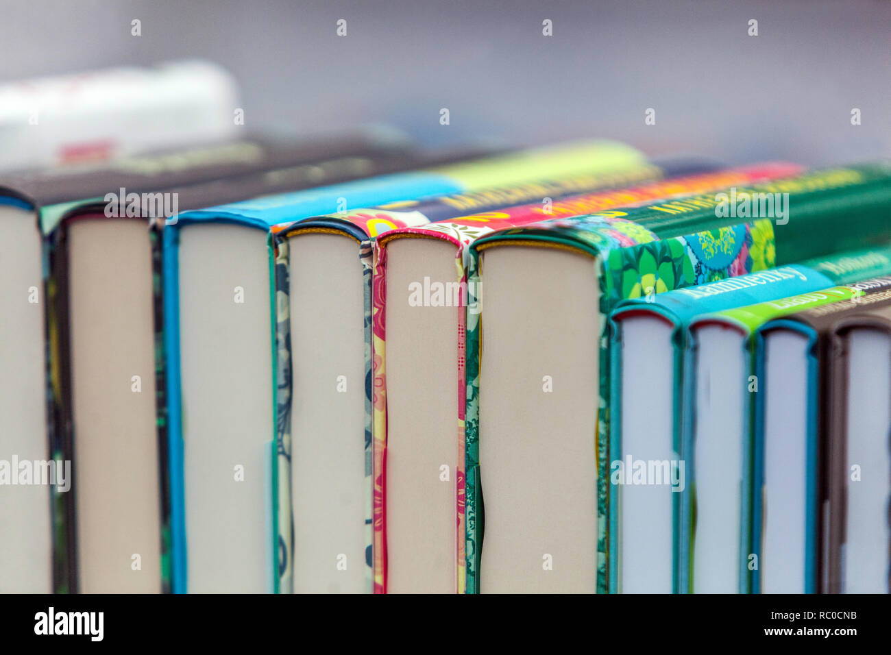 Stacked books on the shelf Stock Photo Alamy