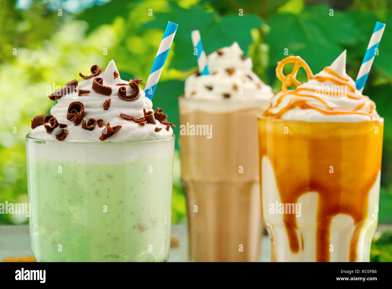 Assorted milkshakes with thick foam Stock Photo Alamy