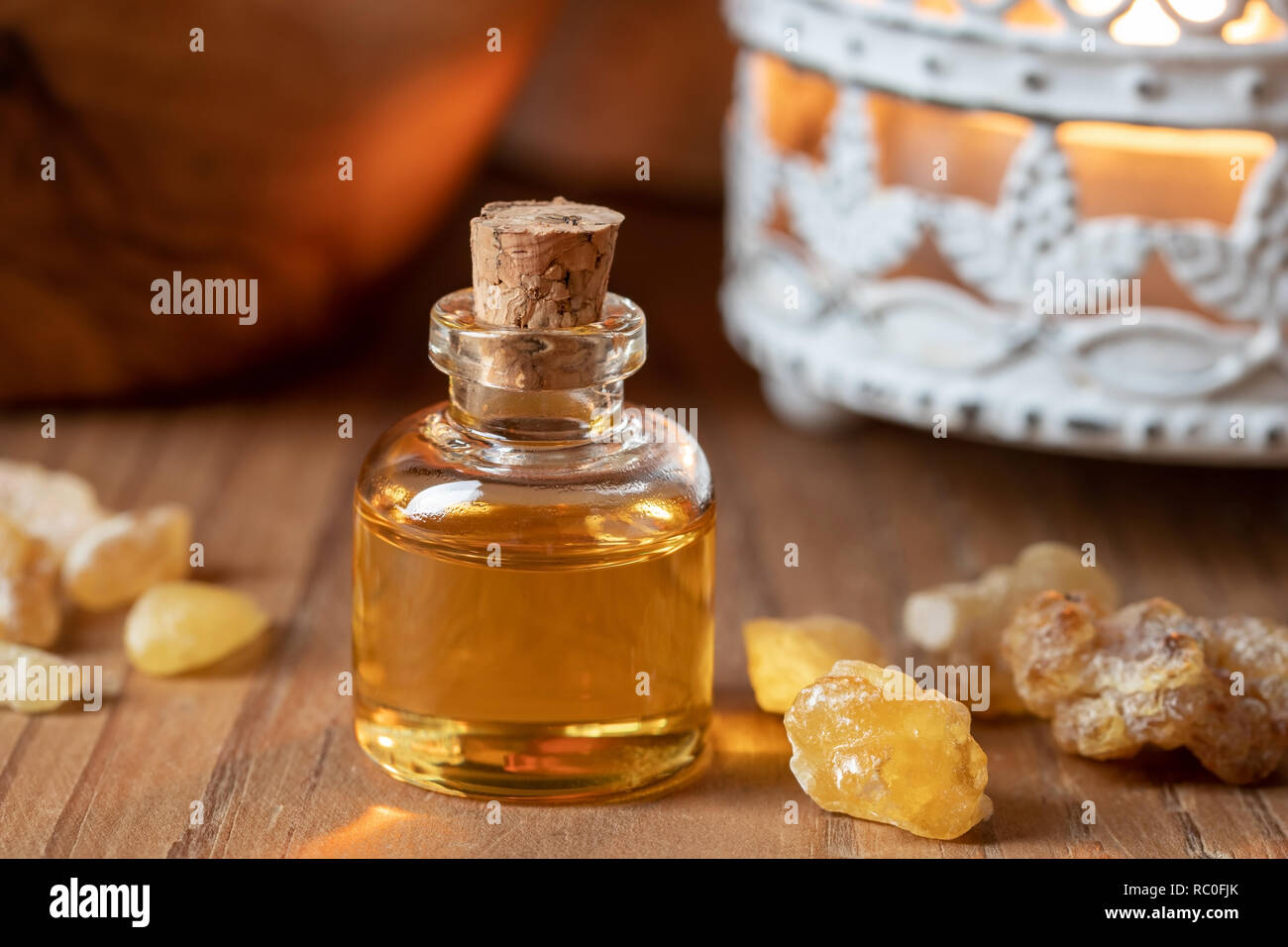 A bottle of essential oil with frankincense resin Stock Photo Alamy