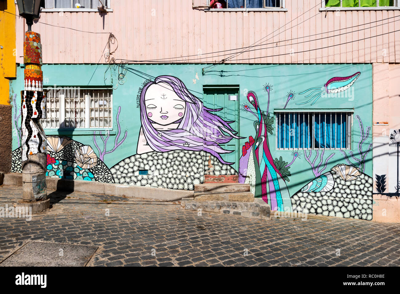 A house front artistically decorated and painted, in a street in Valparaiso, Chile. Stock Photo