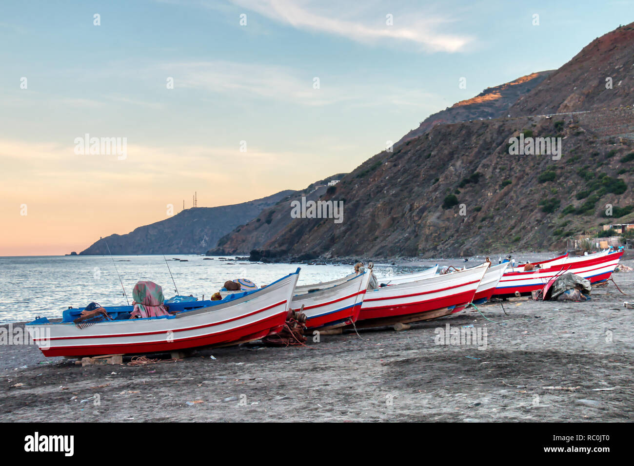 Small fishing boats on the beach of Oued Laou, a coastal town in the province of Chefchaouen, Morocco Stock Photo