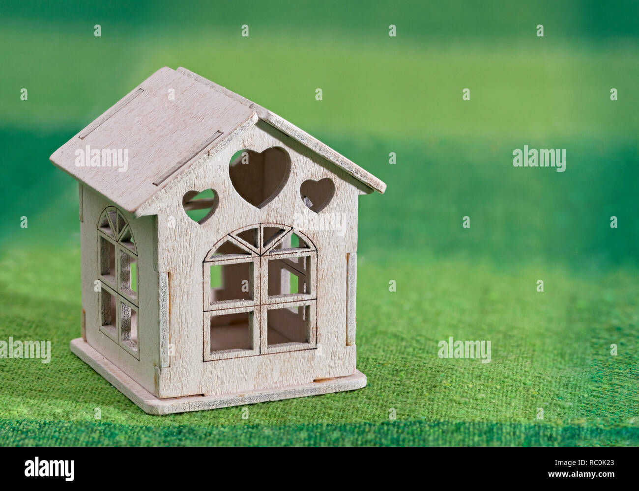 Miniature white toy model house on green Stock Photo Alamy