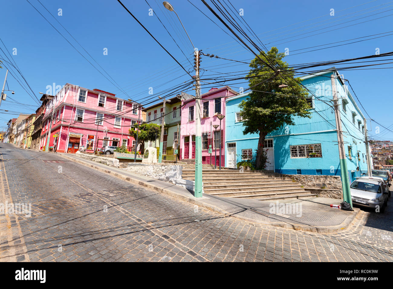 Some colourful buildings beside a street on the steep hills around Valparaiso, Chile. Stock Photo
