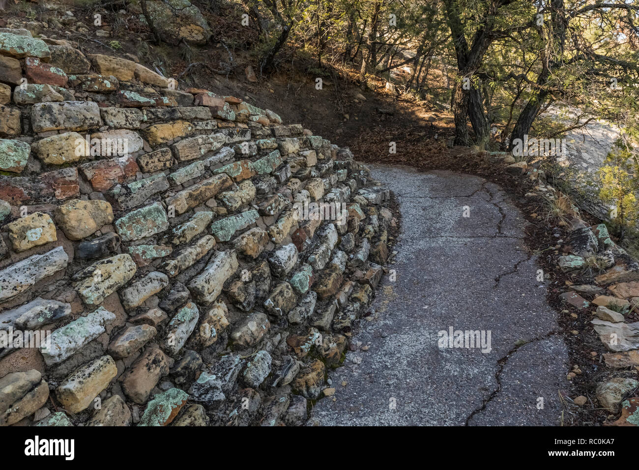 Stone retaining wall along the Mesa Top Trail, which was built by the Civil Works Administration jobs program during the Great Depression in El Morro  Stock Photo