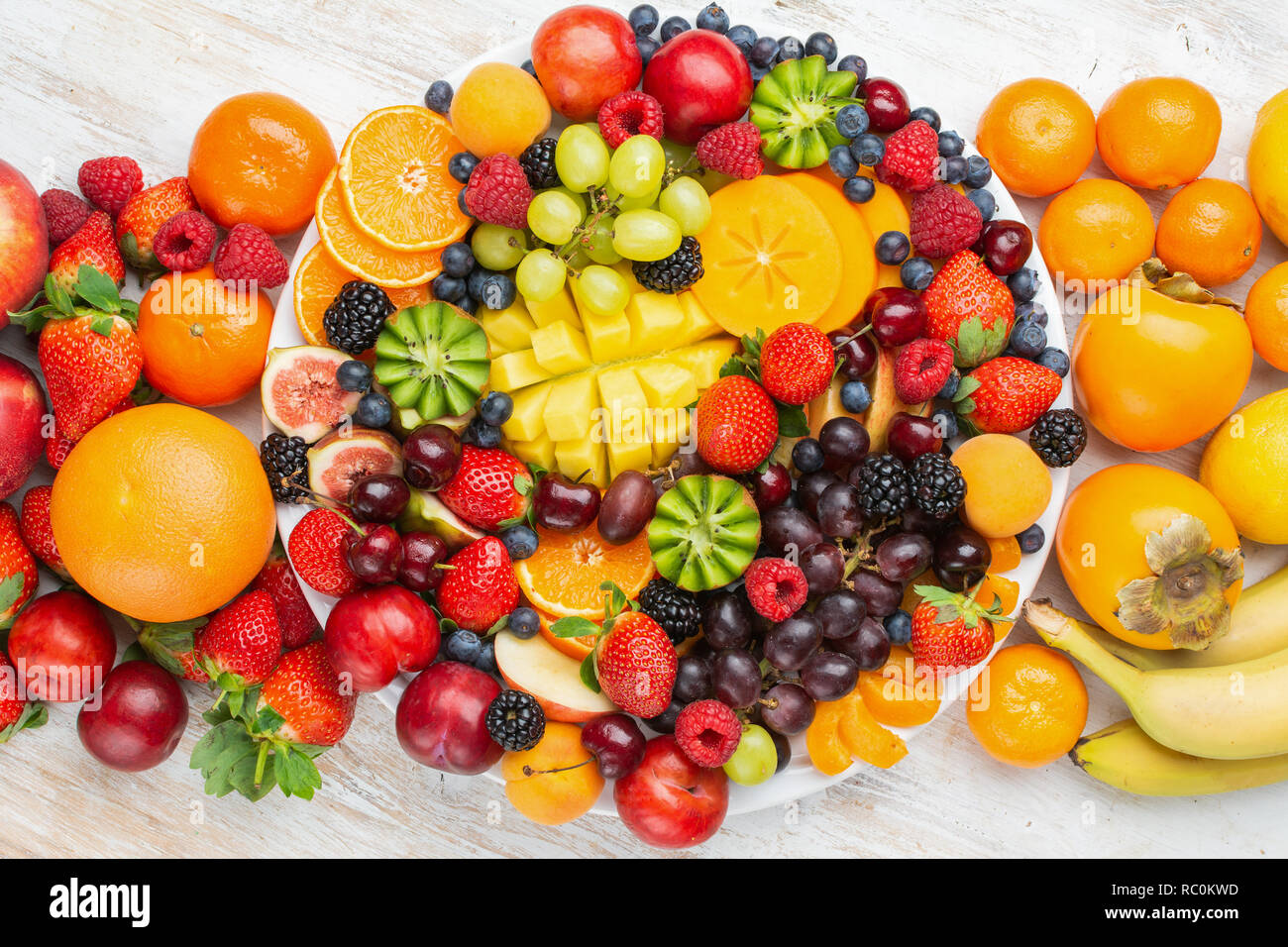 Healthy platter with colorful rainbow fruits, strawberries raspberries ...