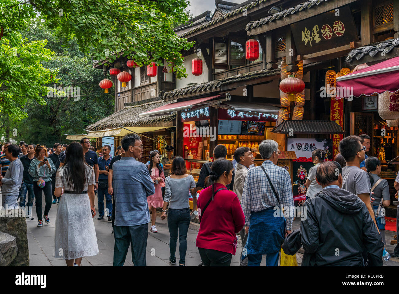 CHENGDU, CHINA - SEPTEMBER 25: Shops and tourists at Jinli Ancient Street an historic pedestrian street and popular travel destination on September 25 Stock Photo