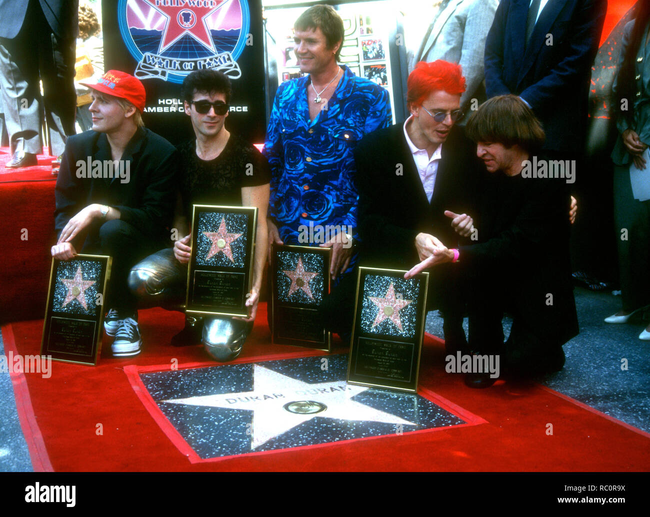 HOLLYWOOD, CA - AUGUST 23: Musicians/singers Nick Rhodes, Warren Cuccurullo, Simon Le Bon and John Taylor of Duran Duran and DJ Rodney Bingenheimer attend the Hollywood Walk of Fame Ceremony Honoring Duran Duran with a Walk of Fame Star on August 23, 1993 at 1770 Vine Street in Hollywood, California. Photo by Barry King/Alamy Stock Photo Stock Photo