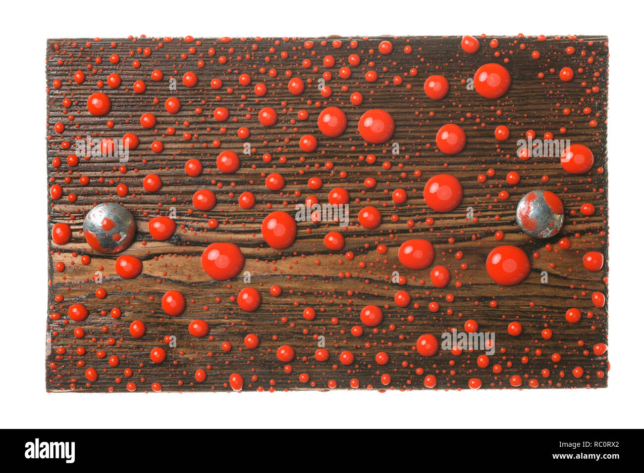 Natural frame made from plank with metal bolts in drops of red paint