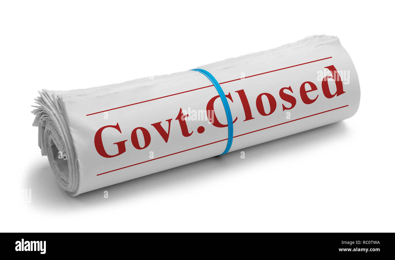 Rolled Newspaper with Govt. Closed Headline Isolated on White. Stock Photo