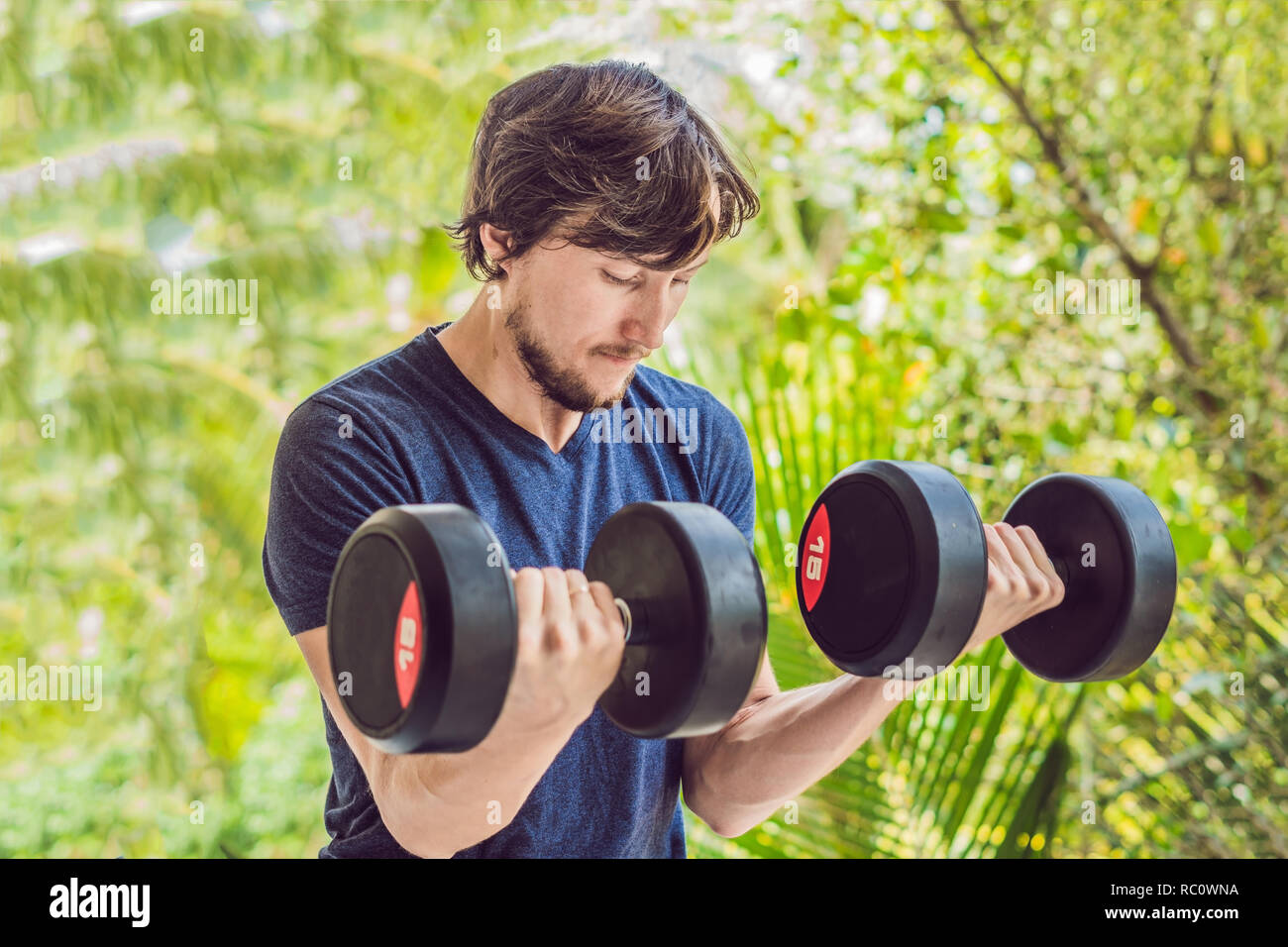 Bicep curl weight training fitness man outside working out arms