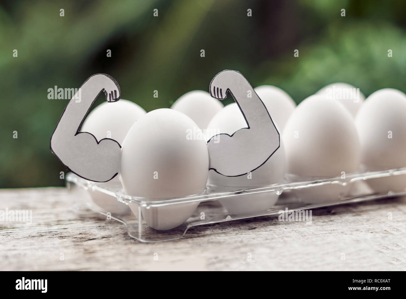 Egg with muscles, concept of egg protein, sports nutrition, diet for