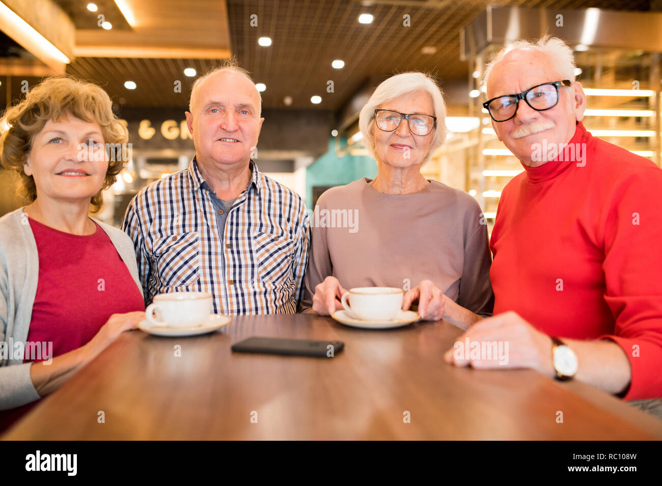 Group of seniors resting in coffee shop Stock Photo Alamy