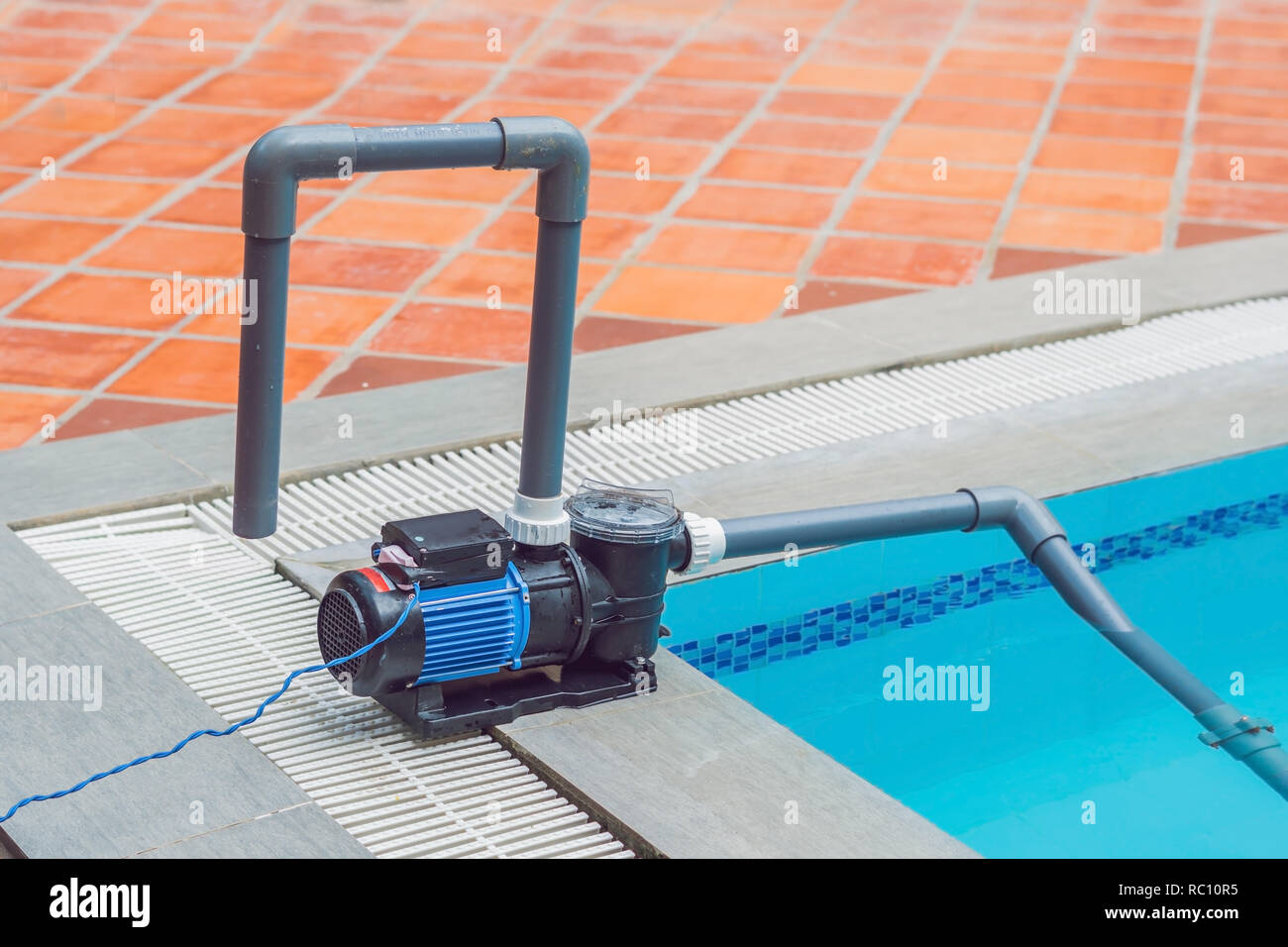 Pool vacuum cleaning flexible hose on the pool Stock Photo Alamy