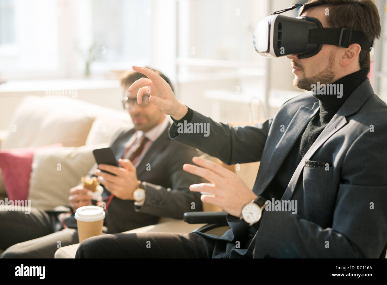 Using virtual reality device during business break Stock Photo