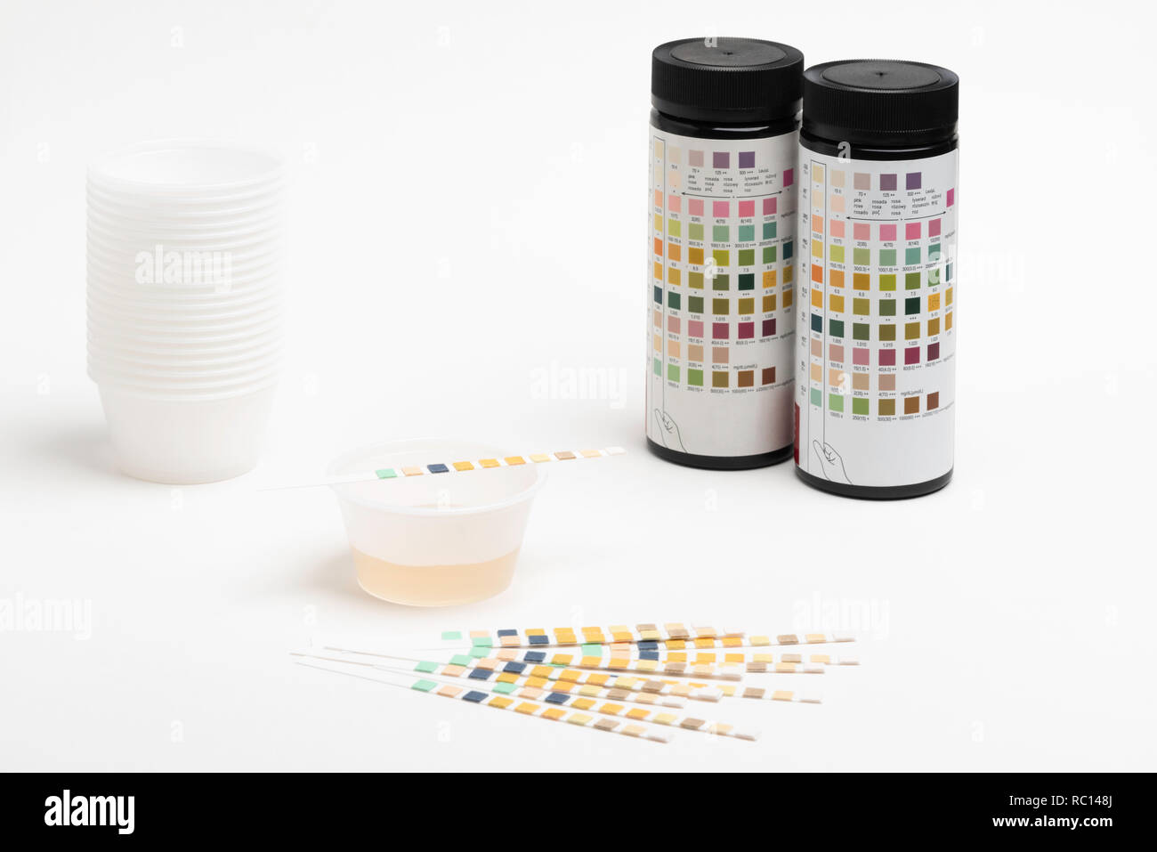 Set of urine reagent test strips in a sample setup for patients, with 2