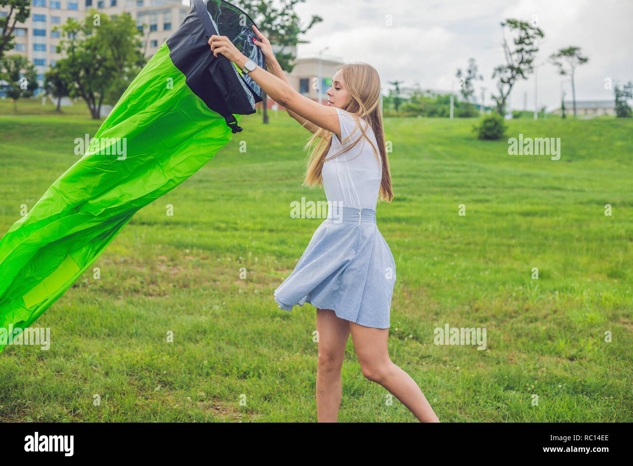 A woman tries to inflate an air sofa Stock Photo Alamy