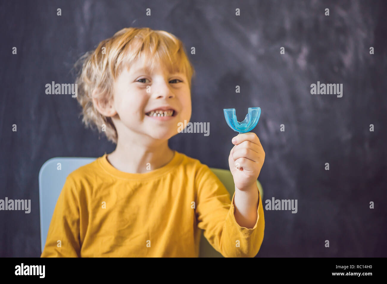Threeyear old boy shows myofunctional trainer. Helps equalize the
