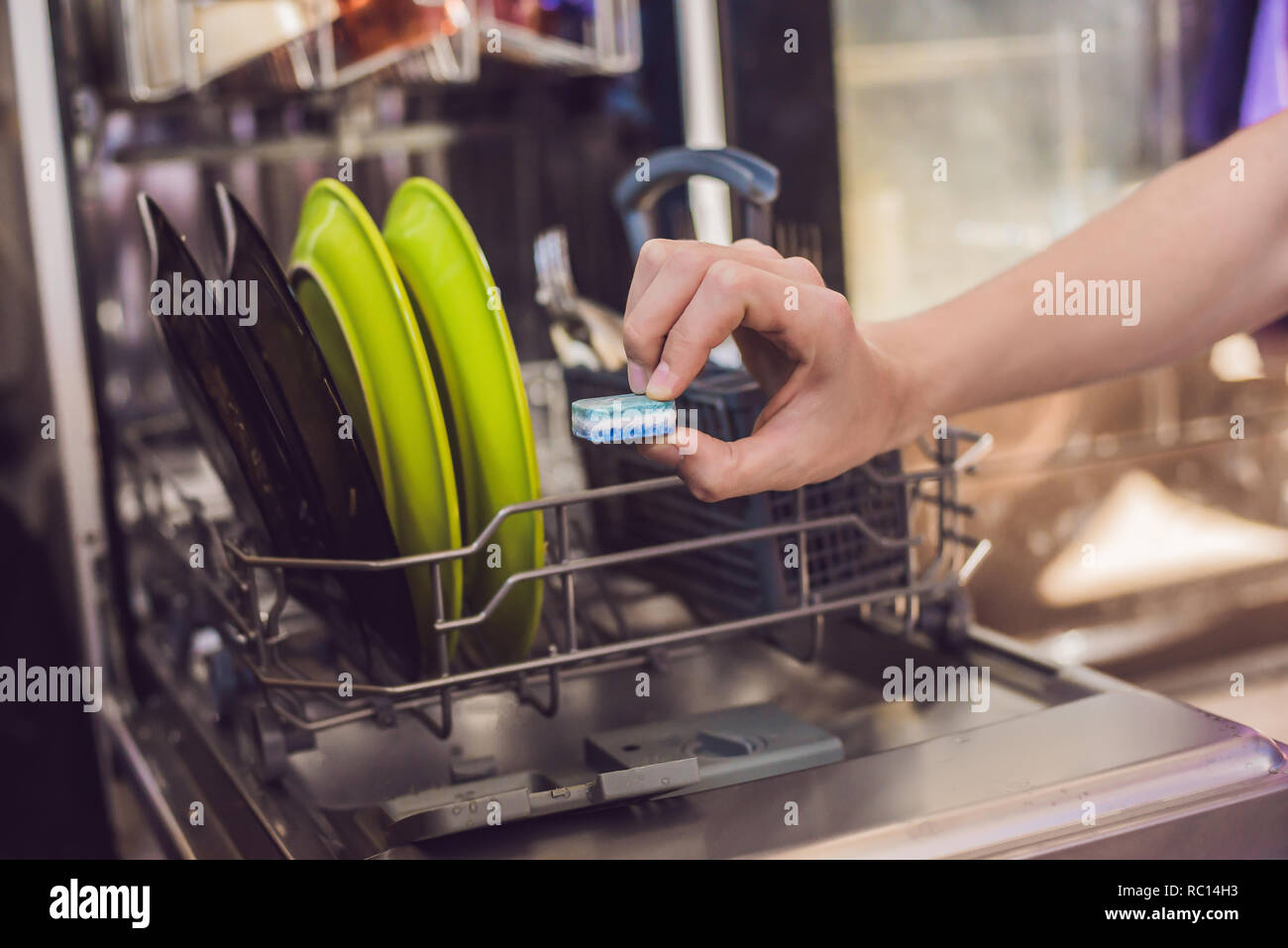 Dishwasher with dirty dishes. Powder, dishwashing tablet and rinse aid