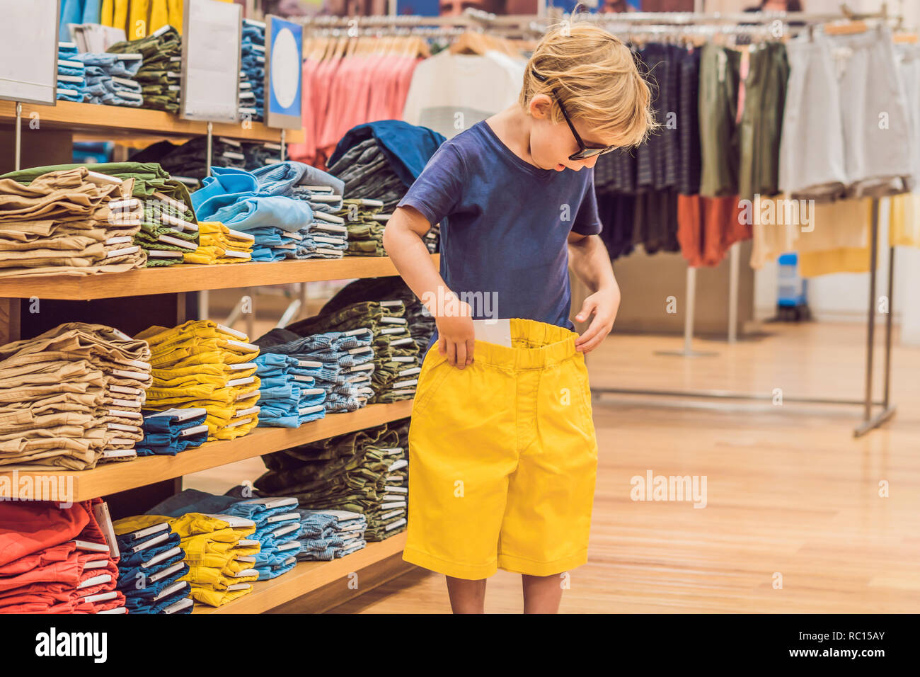 Boy in clothes shop hires stock photography and images Alamy