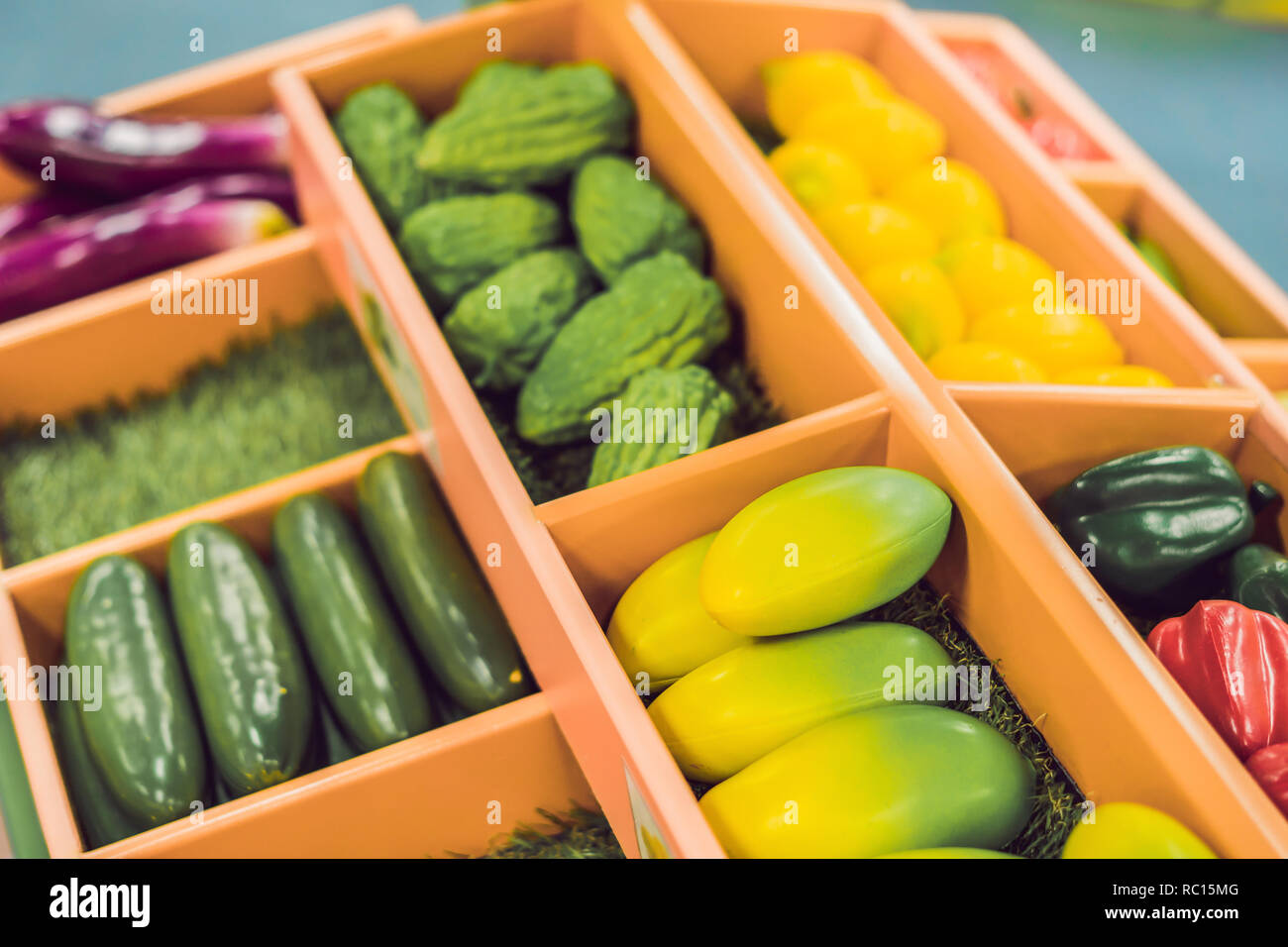 Plastic game, fake varied vegetables and fruits. Children food