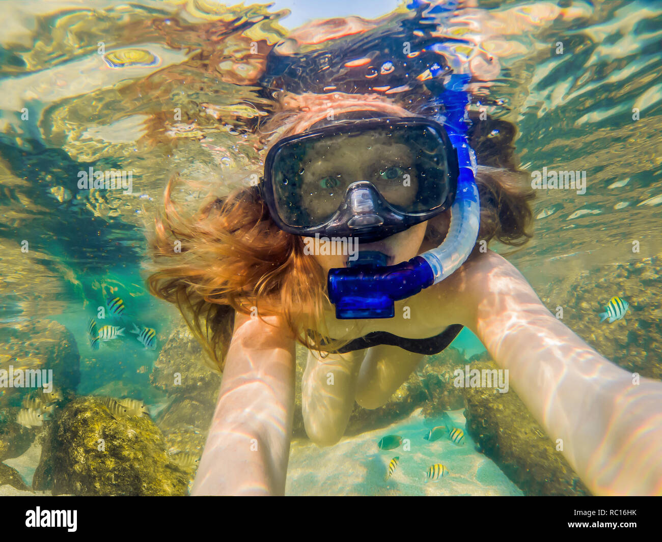 Woman Snorkeling In Red Snorkel High Resolution Stock Photography and ...