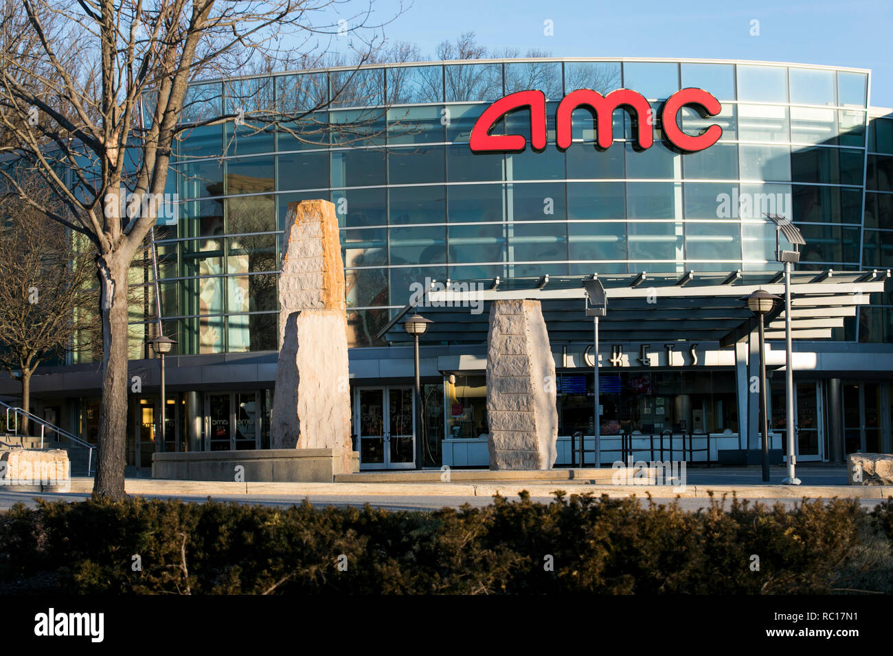 A logo sign outside of a AMC Theaters movie theater in Columbia