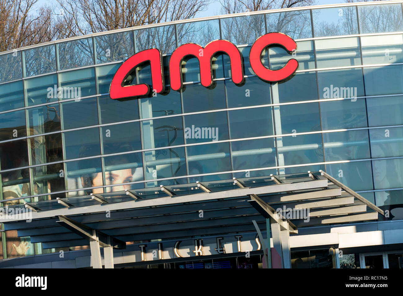 A logo sign outside of a AMC Theaters movie theater in Columbia