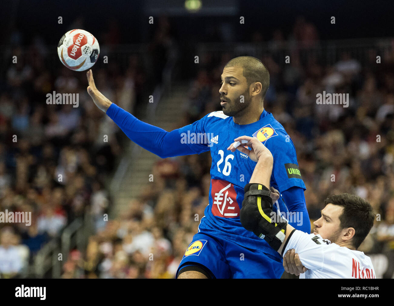 Berlin, Germany. 12th Jan, 2019. Handball: WM, France - Serbia, preliminary round, group A, 2nd matchday. France's Nicolas Claire (l) against Serbia's Drasko Nenadic. Credit: Soeren Stache/dpa/Alamy Live News Stock Photo