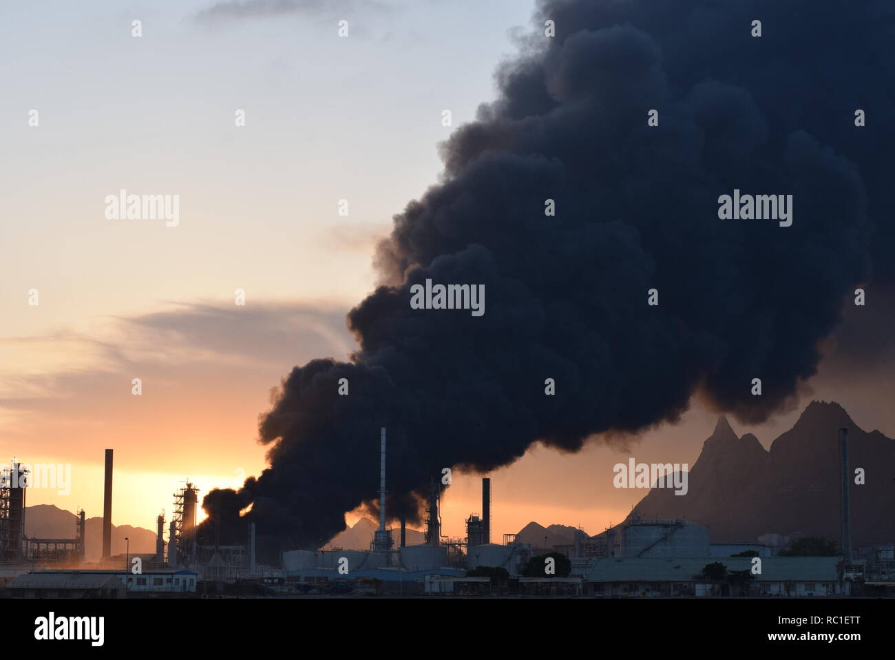 Beijing, China. 12th Jan, 2019. Photo taken on Jan. 12, 2019 shows heavy smoke from a state-owned oil refinery in Aden, Yemen. A new powerful explosion hit the the state-owned oil refinery in Aden on Saturday evening, injuring at least 15 people, a security official told Xinhua. Credit: Murad Abdo/Xinhua/Alamy Live News Stock Photo