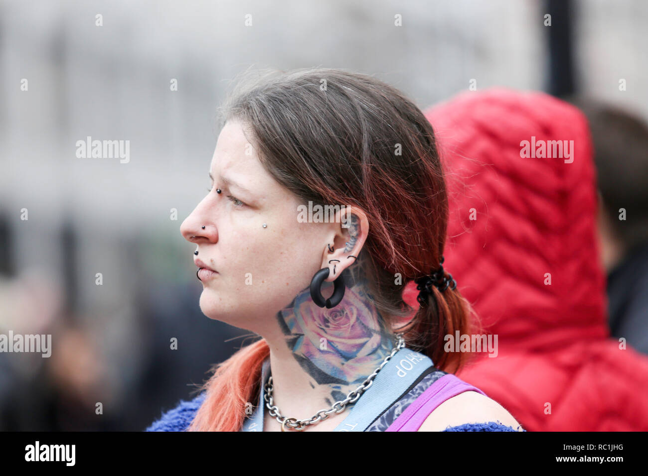 London, UK. 12th Jan, 2019.12th Jan, 20189. A woman at Oxford Circus with ear tattoo. Penelope Barritt/Alamy Live News Stock Photo