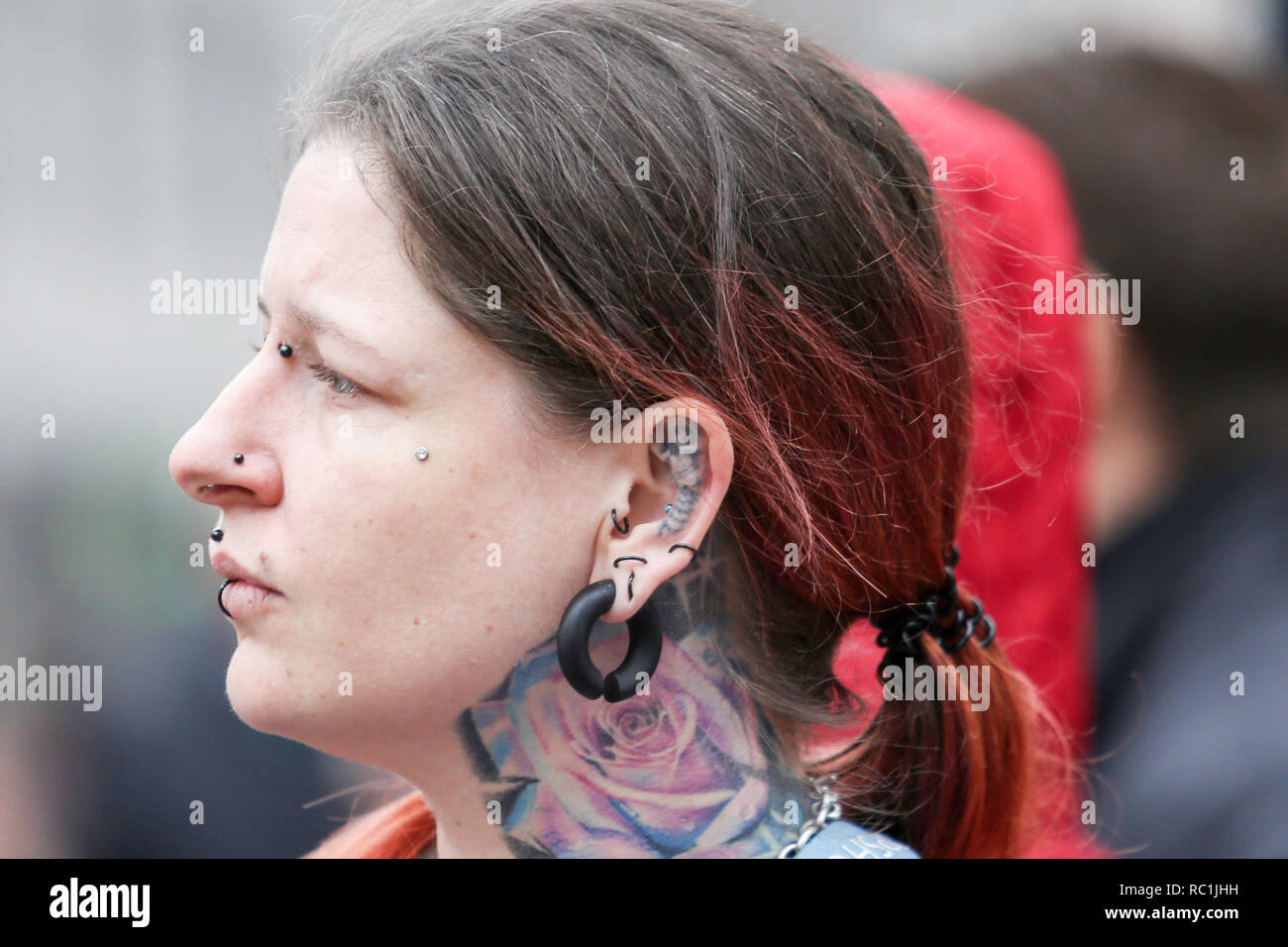 London, UK. 12th Jan, 2019.12th Jan, 20189. A woman at Oxford Circus with ear tattoo. Penelope Barritt/Alamy Live News Stock Photo