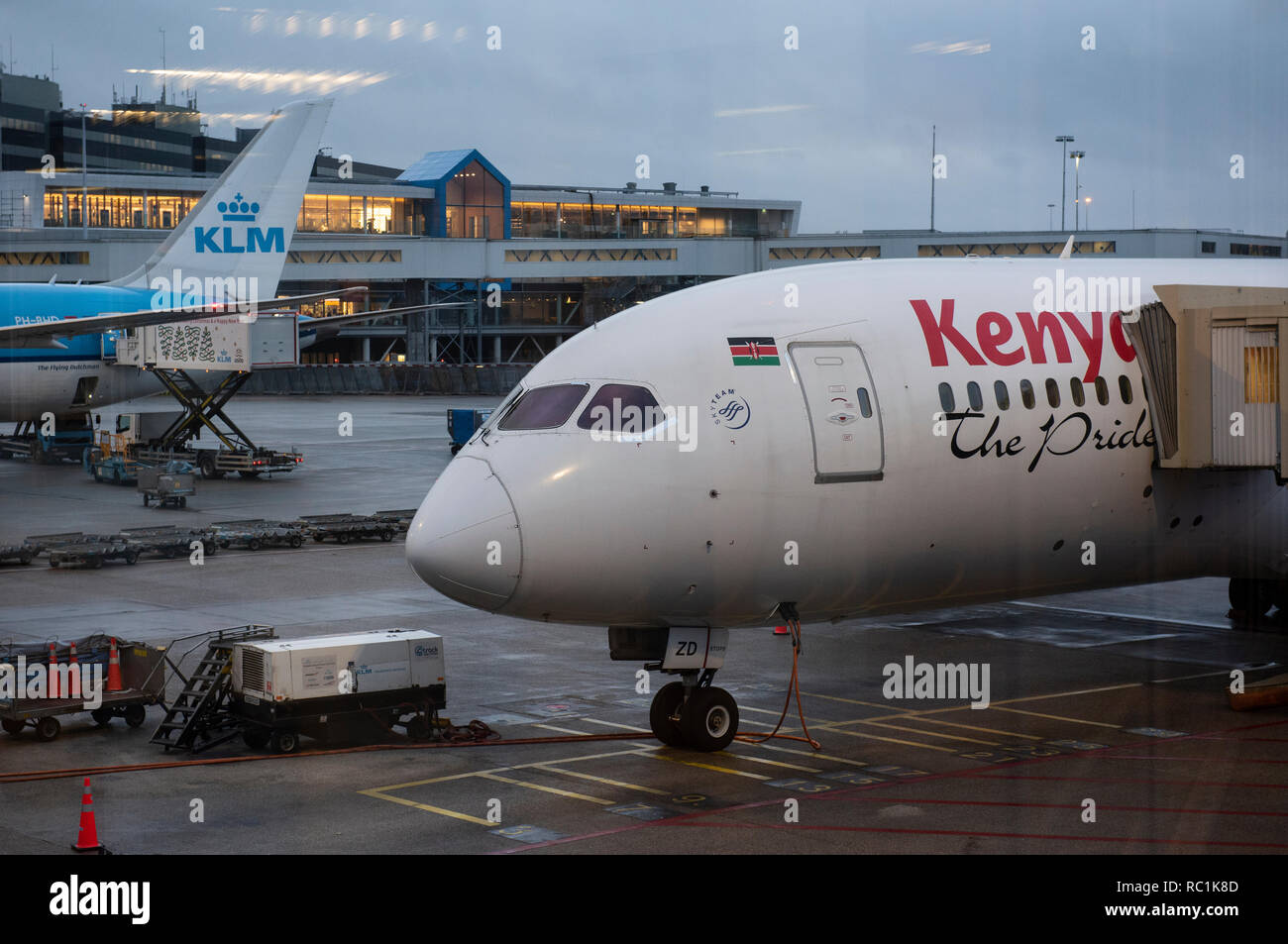 Kenya Airways and KLM Royal Dutch Airlines planes are seen at Amsterdam Schiphol Airport runway. Stock Photo