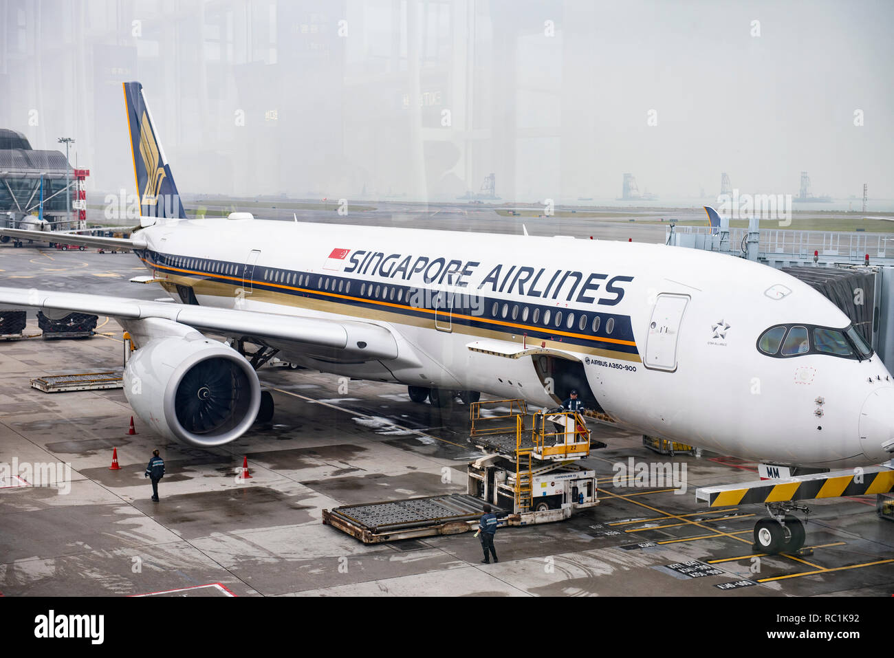 Singapore Airlines plane, Singapore's flag carrier, is seen at Hong Kong International Airport runway. Stock Photo