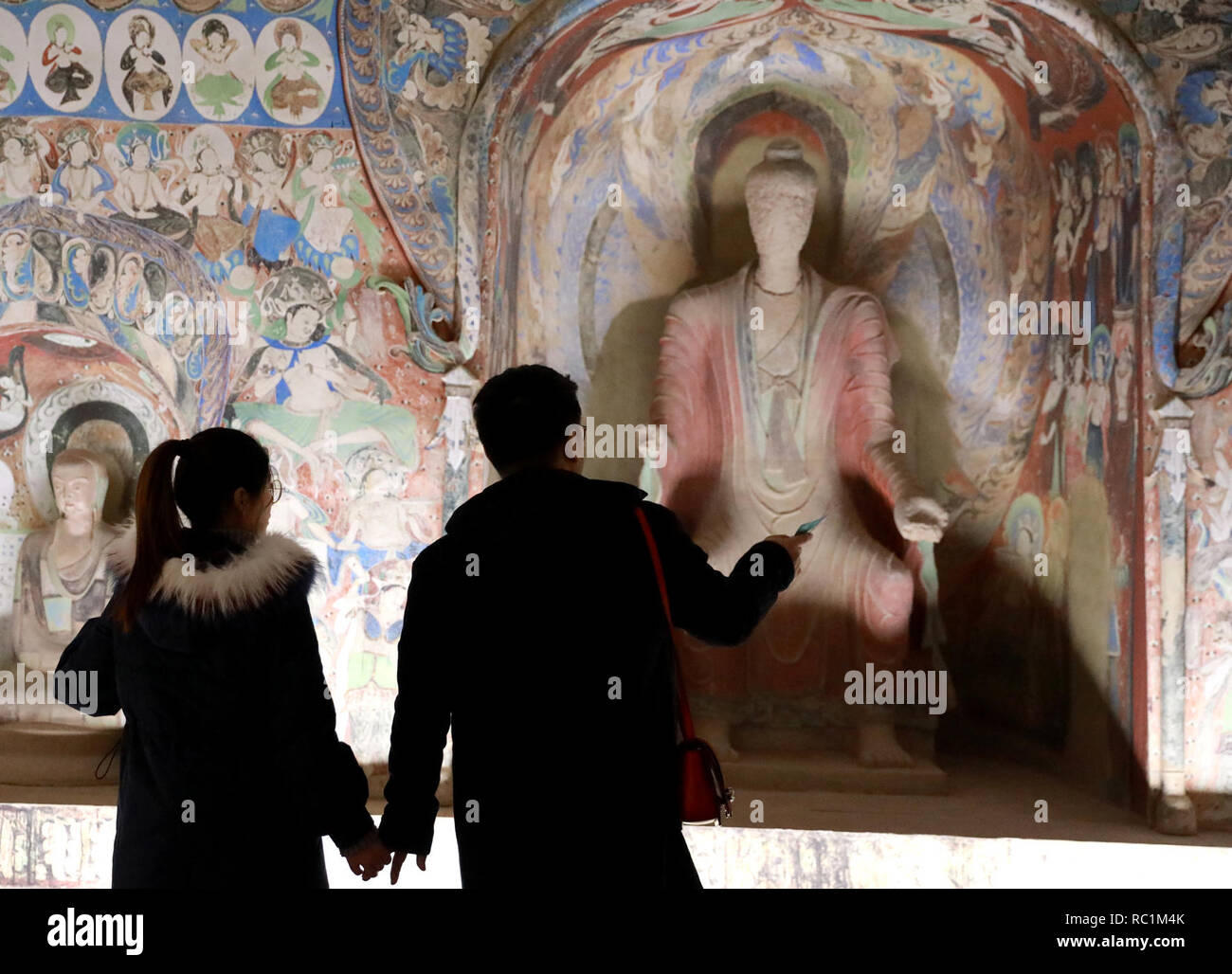 Shijiazhuang, China's Hebei Province. 12th Jan, 2019. People visit the  Dunhuang digital exhibition debuted at the Hebei Museum in Shijiazhang,  capital of north China's Hebei Province, Jan. 12, 2019. The exhibition uses