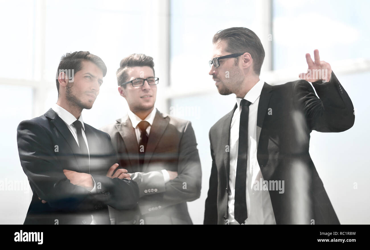 business partners standing near the office window Stock Photo - Alamy
