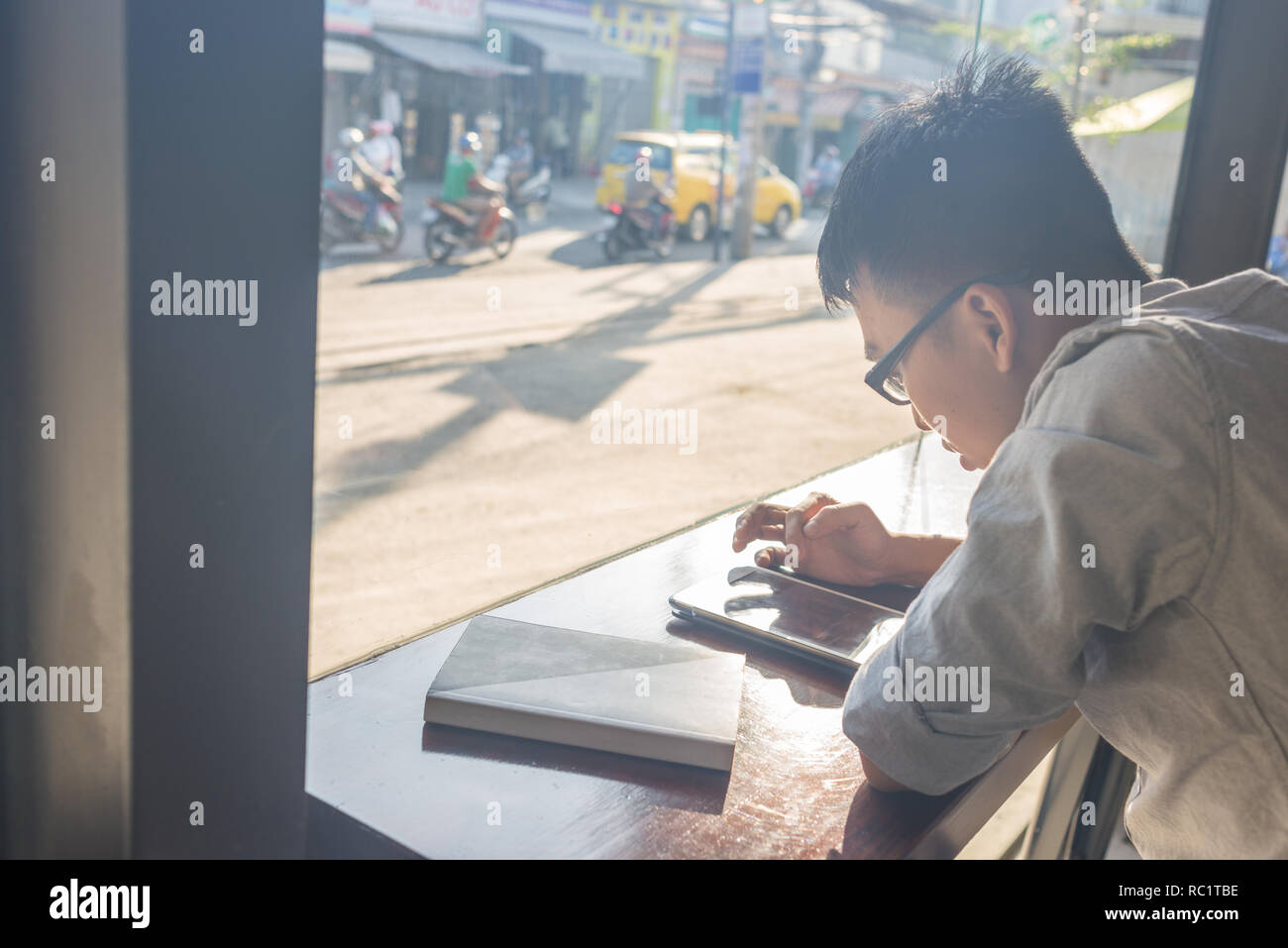 Asian young student using tablet Stock Photo