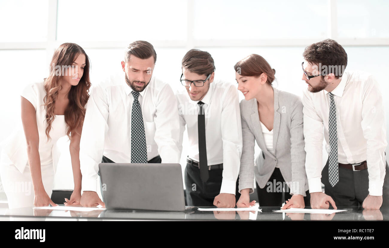 business team standing near the desktop Stock Photo - Alamy