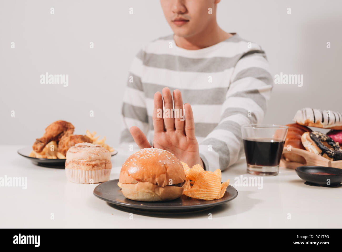 Young man in dieting and healthy eating concept Stock Photo