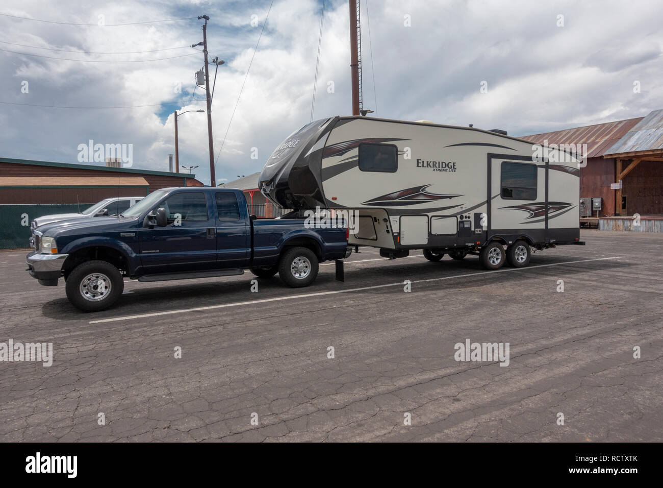 A fifth wheel camper trailer (Elkridge xtreme lite) attached to a Ford Super Duty F250 truck parked in Williams, northern Arizona, USA. Stock Photo