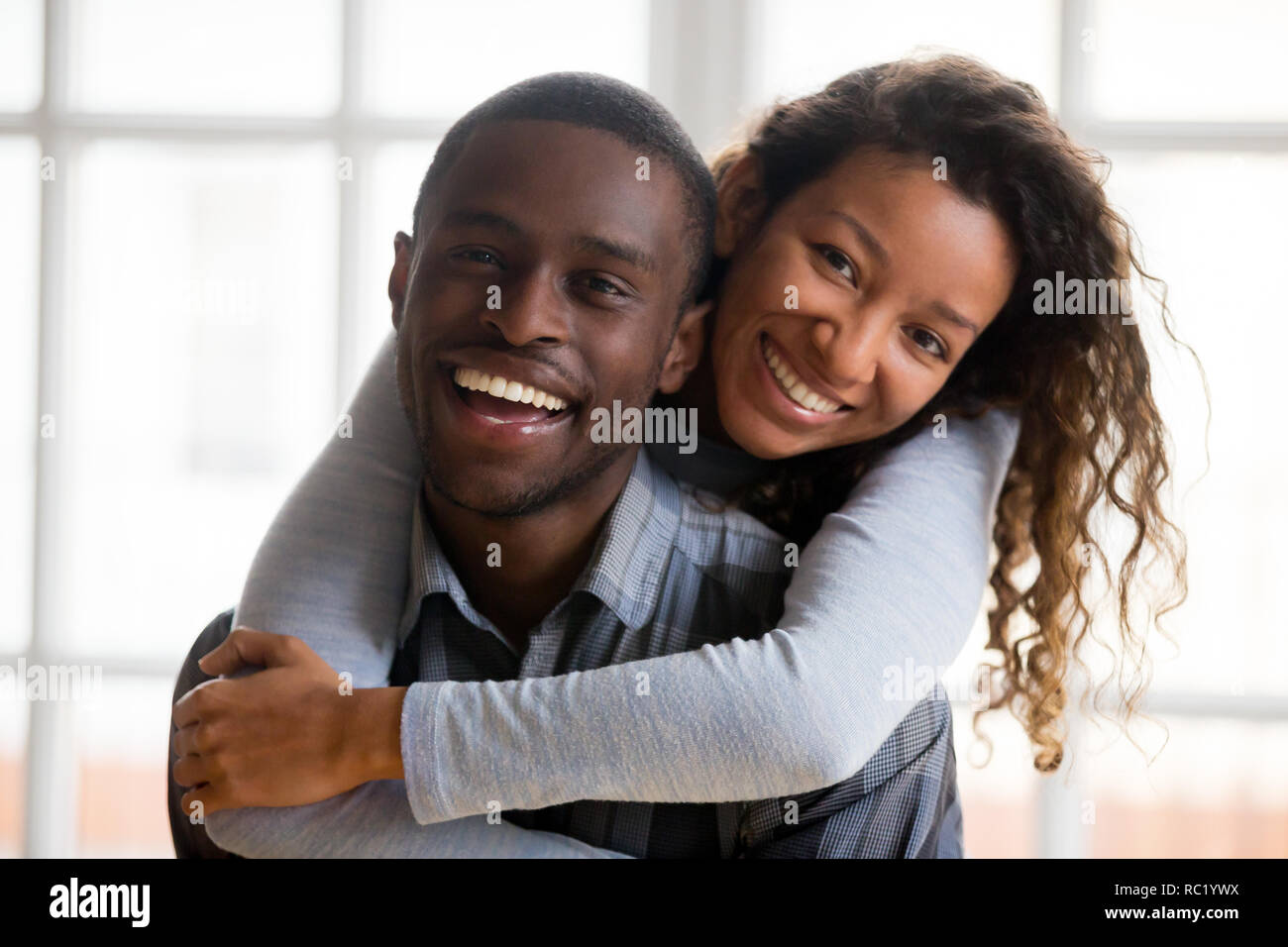 Portrait of happy african american couple embracing looking at c Stock ...