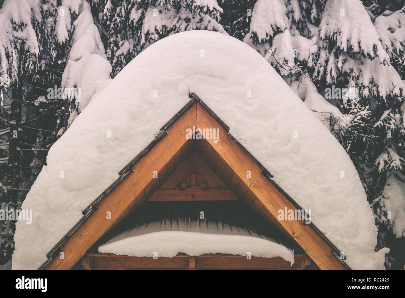 Heavy Snow Weather Concept. Wooden Architectural Element Covered by Heavy Snow. Stock Photo