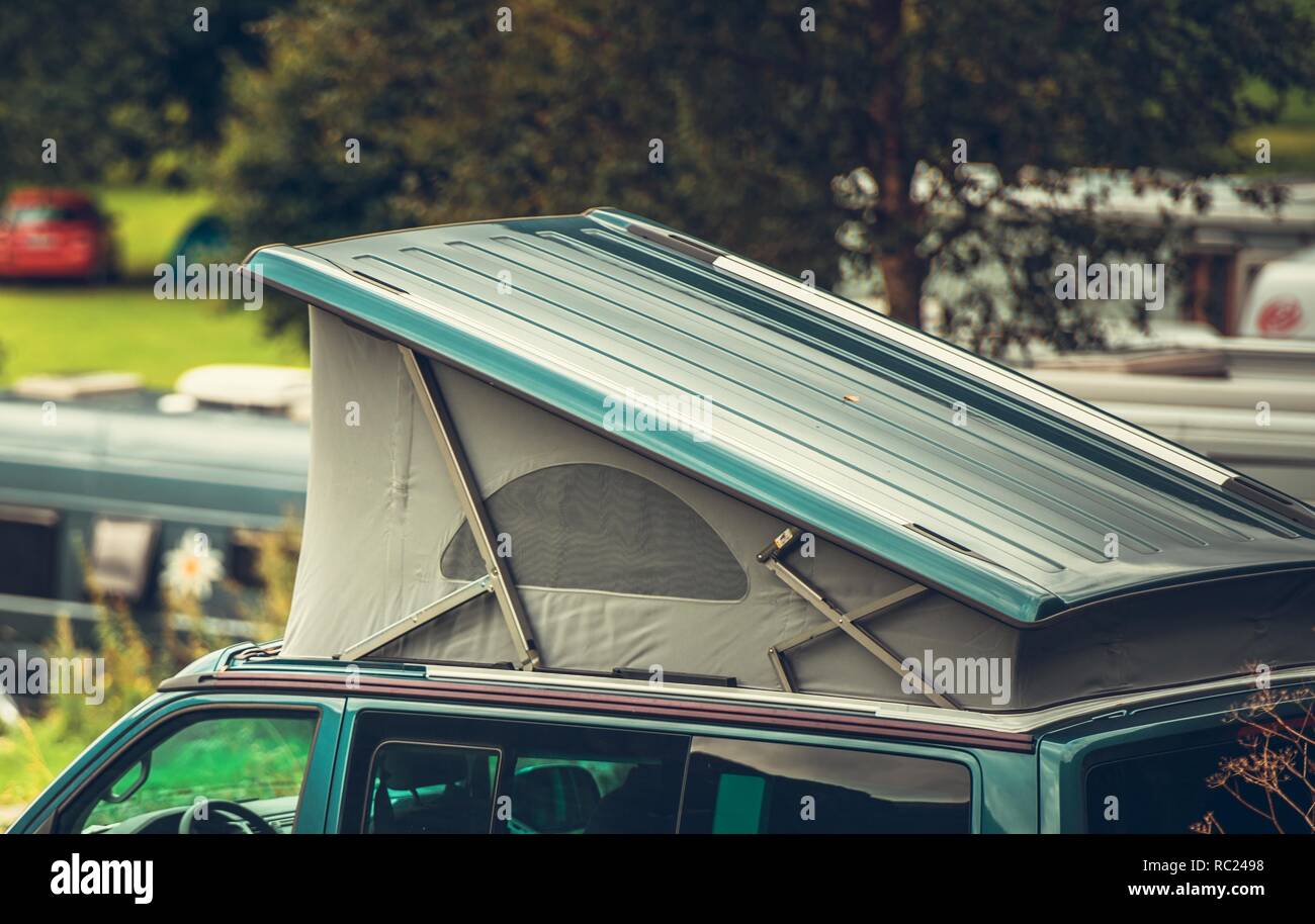 Vehicle Roof Tent Camper Van Camping. Vacation on the Go. Stock Photo